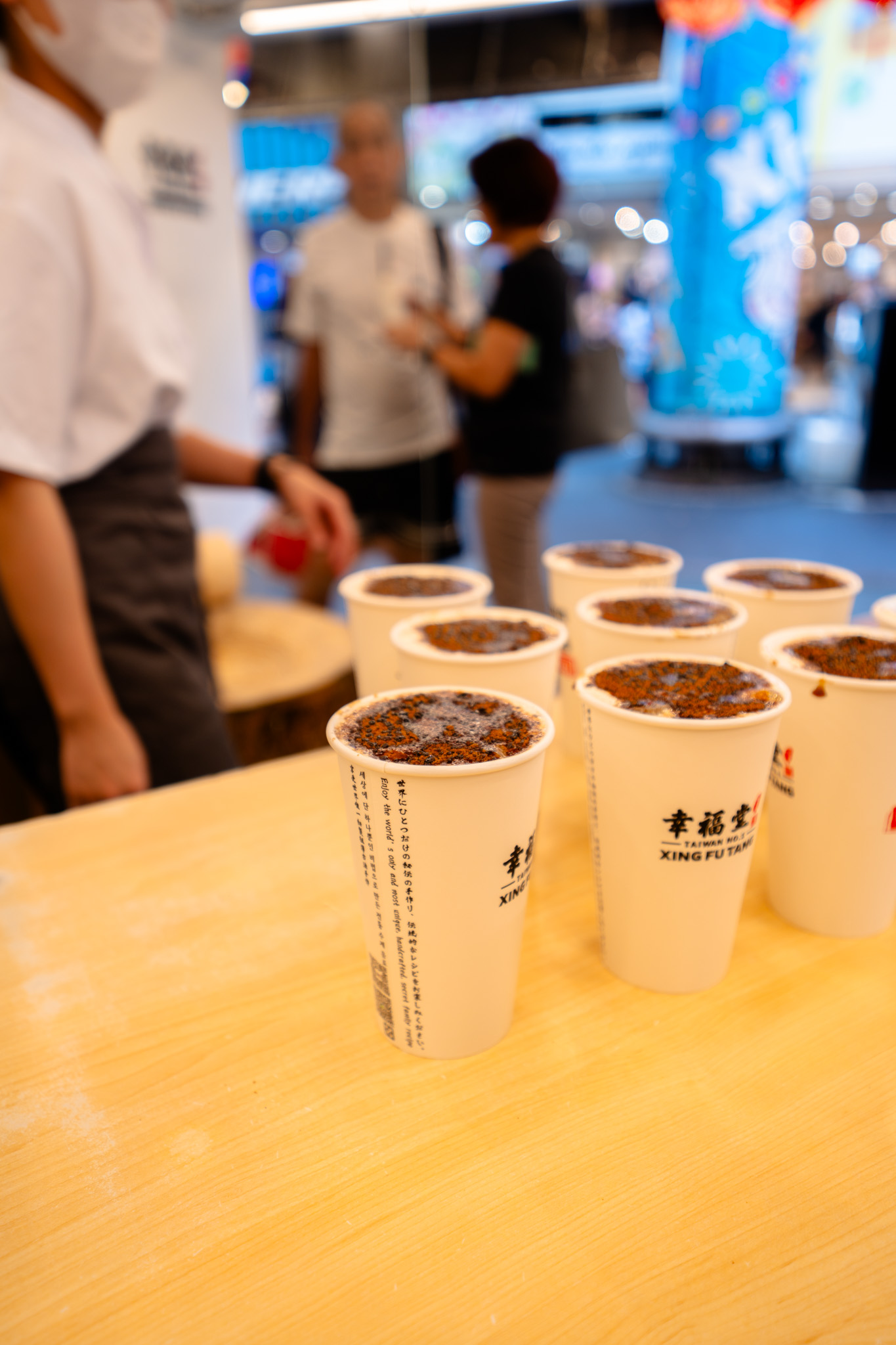 Xing Fu Tang boba tea cups displayed on a counter